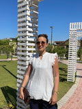 White ruffle blouse